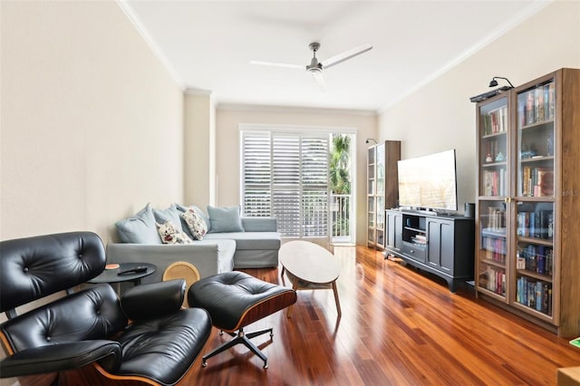 living room with crown molding, hardwood / wood-style flooring, and ceiling fan