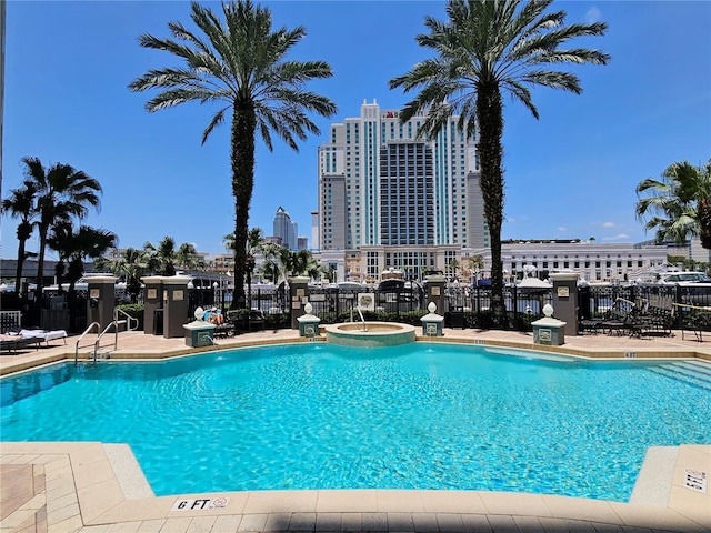 700 S Harbour Island Blvd Unit 226, Tampa, FL 33602 - view of swimming pool with fence, a pool with connected hot tub, and a city view