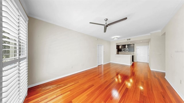 700 S Harbour Island Blvd Unit 226, Tampa, FL 33602 - unfurnished living room with a ceiling fan, baseboards, and wood finished floors