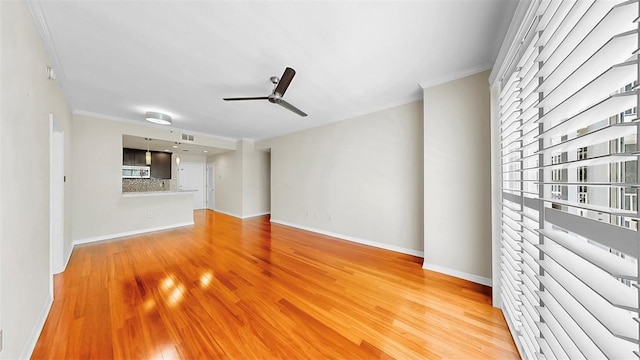 700 S Harbour Island Blvd Unit 226, Tampa, FL 33602 - unfurnished living room with ceiling fan, crown molding, light wood-style floors, and baseboards