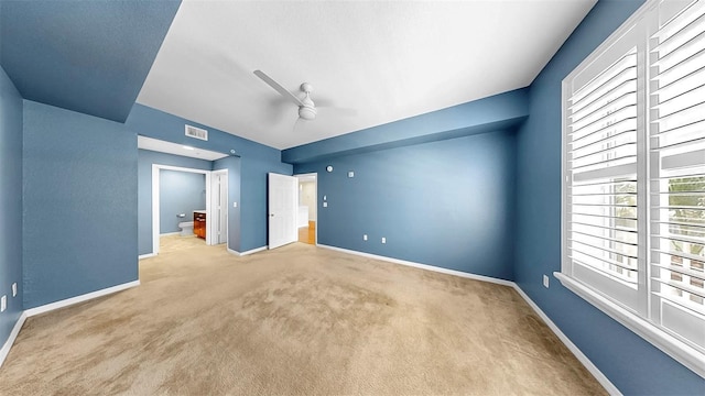 700 S Harbour Island Blvd Unit 226, Tampa, FL 33602 - unfurnished bedroom featuring carpet floors, baseboards, ensuite bathroom, and a ceiling fan