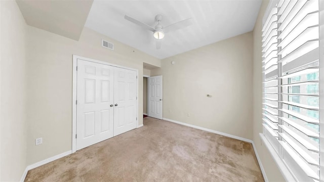 700 S Harbour Island Blvd Unit 226, Tampa, FL 33602 - unfurnished bedroom featuring carpet, a closet, baseboards, and a ceiling fan