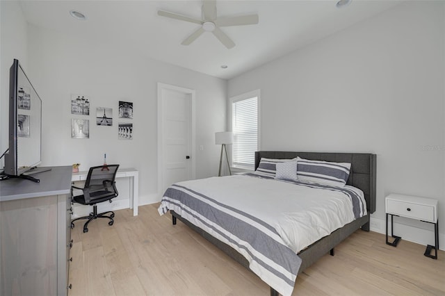 bedroom with ceiling fan and light wood-type flooring