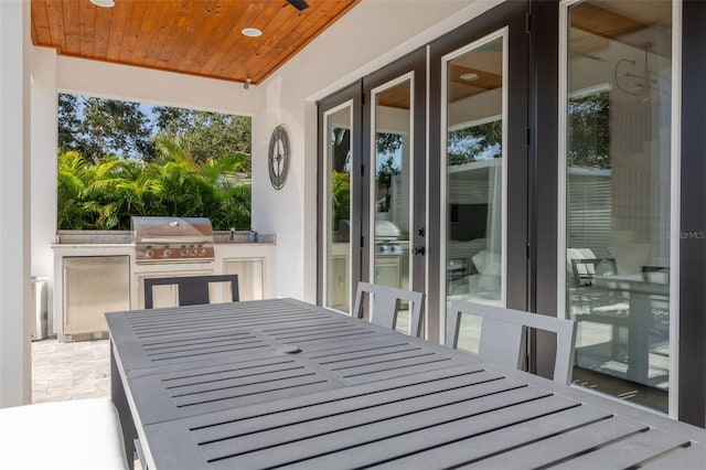 sunroom with wood ceiling