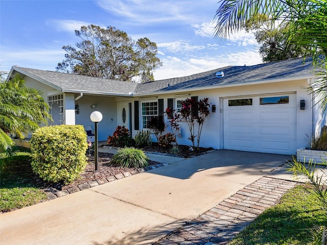 single story home featuring a garage