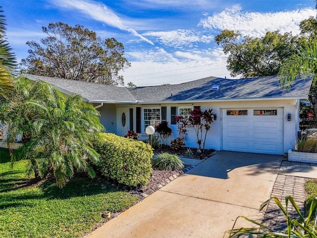 ranch-style house featuring a garage