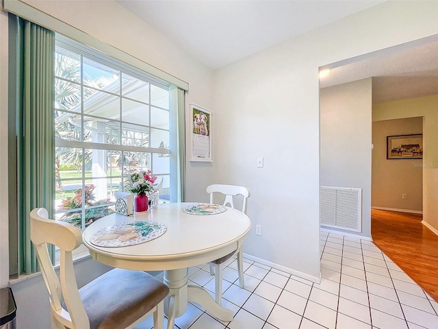 dining room with light tile patterned floors