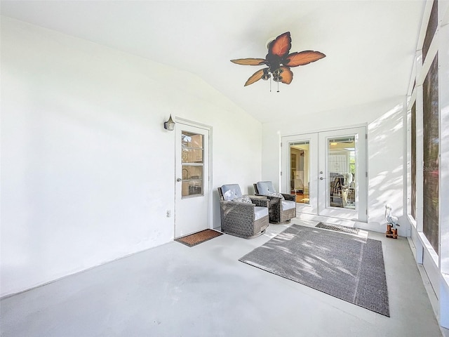 sunroom / solarium with french doors, vaulted ceiling, and ceiling fan