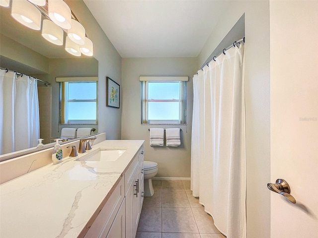 bathroom with tile patterned flooring, vanity, a shower with shower curtain, and toilet