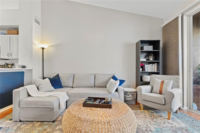 living room featuring vaulted ceiling