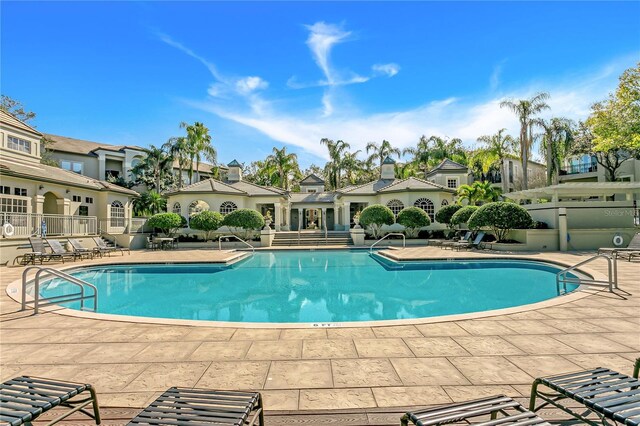 view of swimming pool featuring a patio area