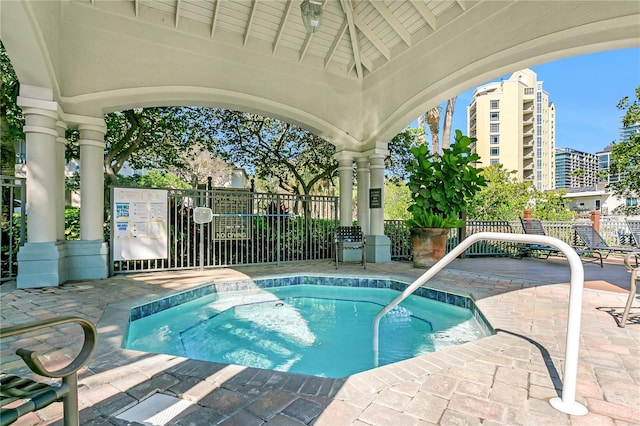 view of pool with a community hot tub