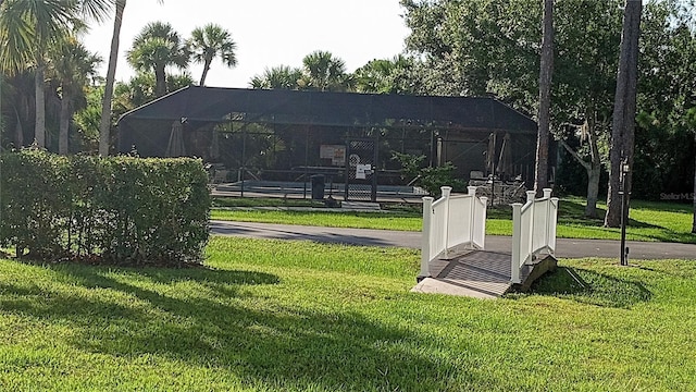 view of home's community with a lawn