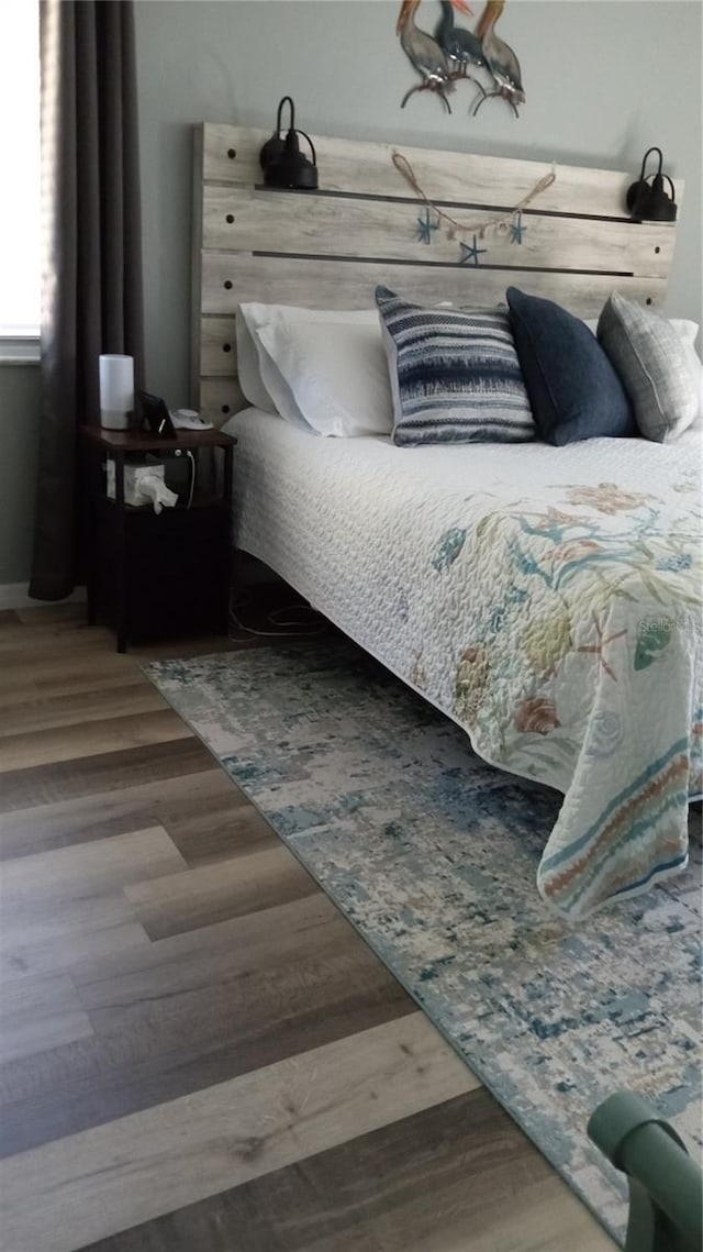 bedroom featuring hardwood / wood-style flooring