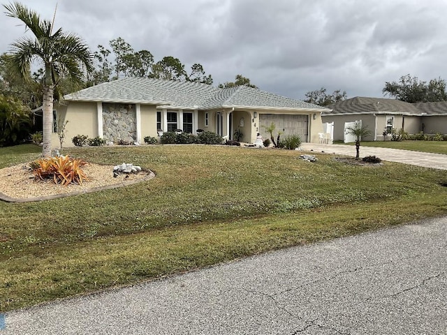 ranch-style home with a front yard and a garage