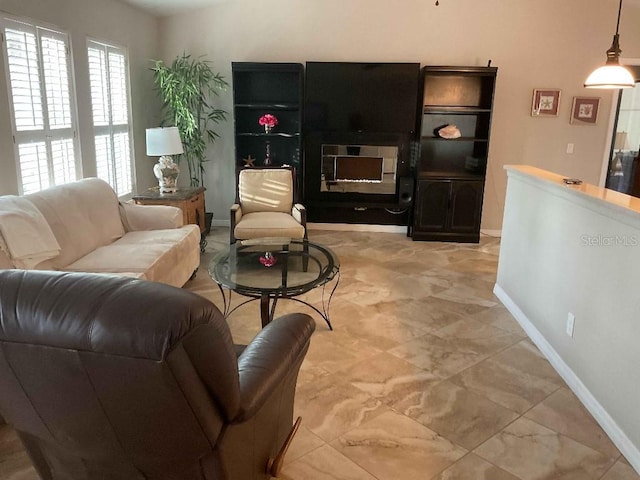 living room featuring a fireplace