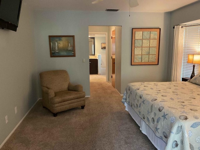 carpeted bedroom with connected bathroom and ceiling fan