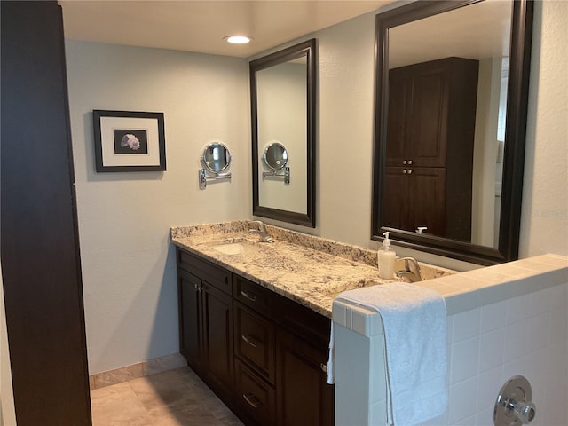 bathroom with vanity and tile patterned flooring