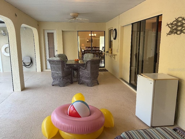 view of patio featuring ceiling fan