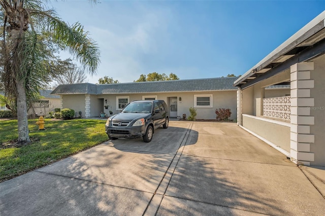 ranch-style home featuring a front yard