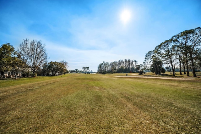 surrounding community featuring a lawn