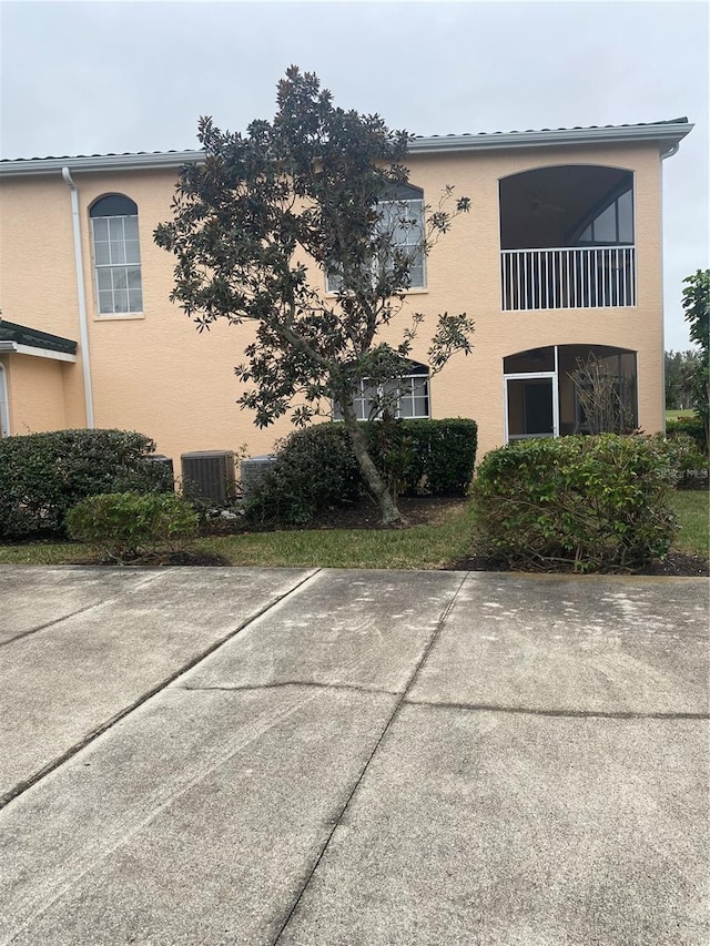 view of property featuring central AC unit