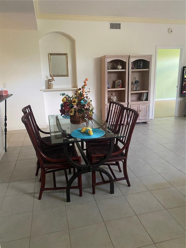 dining space featuring light tile patterned flooring