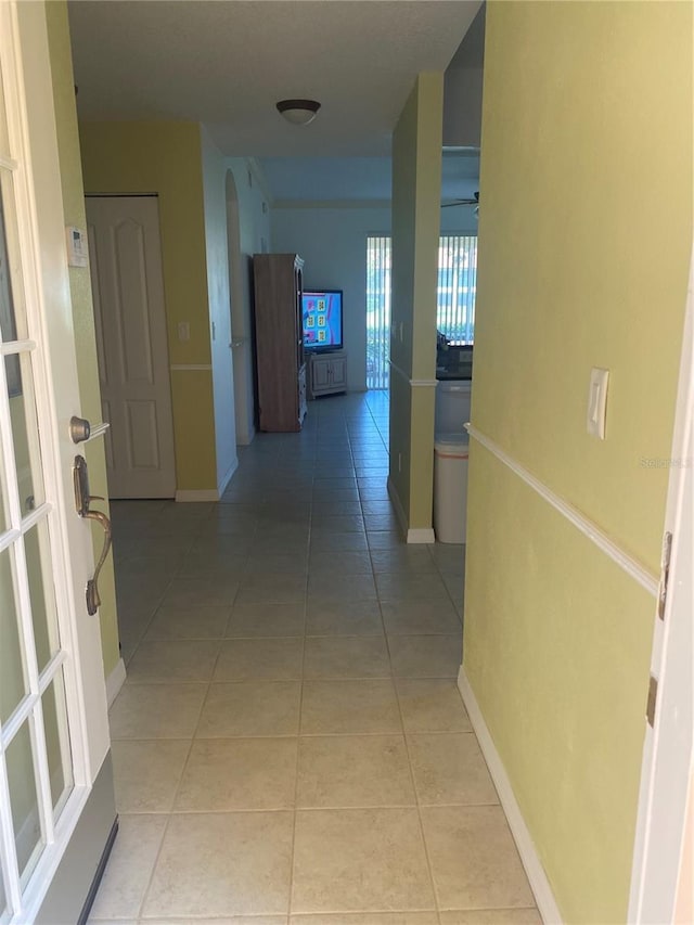 hall with light tile patterned flooring