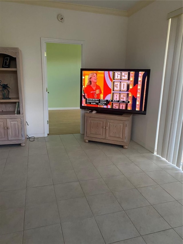 tiled living room featuring crown molding