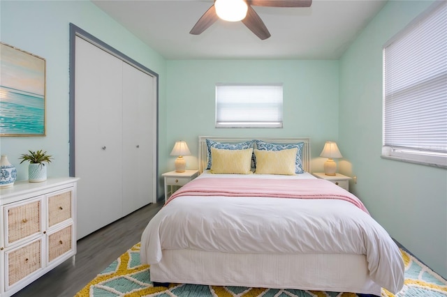 bedroom with ceiling fan, a closet, and dark hardwood / wood-style floors