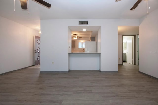 unfurnished living room featuring hardwood / wood-style floors