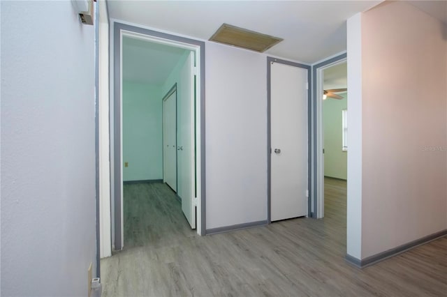 corridor featuring light hardwood / wood-style floors