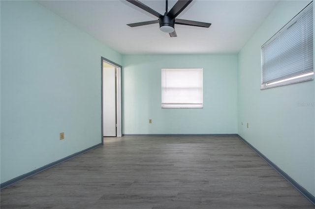 empty room featuring ceiling fan and wood-type flooring