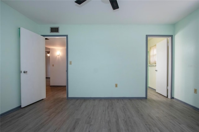 unfurnished bedroom featuring ceiling fan and wood-type flooring