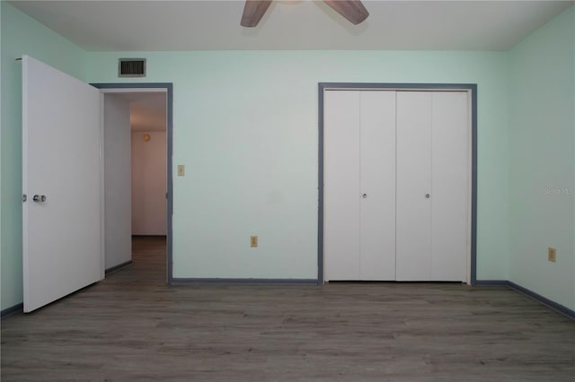 unfurnished bedroom featuring ceiling fan, a closet, and light hardwood / wood-style floors