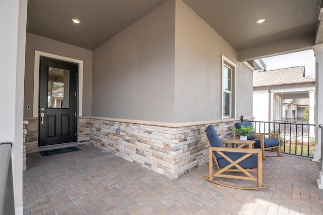 property entrance with covered porch