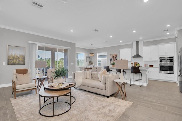 living room featuring crown molding