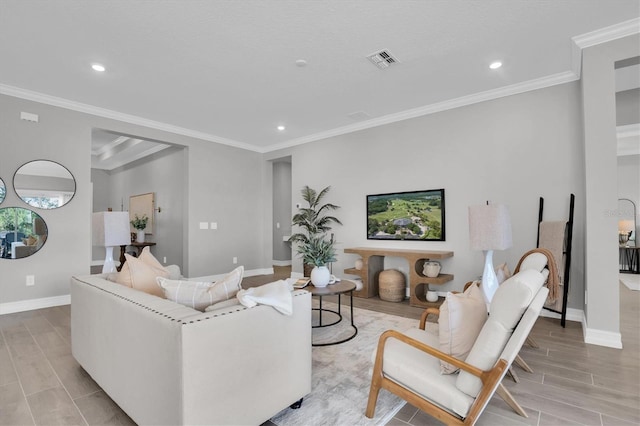 living room featuring crown molding