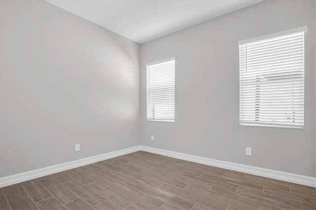 spare room with light hardwood / wood-style flooring