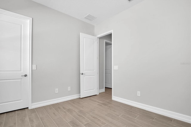 unfurnished bedroom with light hardwood / wood-style floors