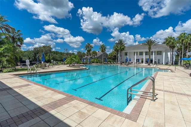 view of swimming pool with a patio area