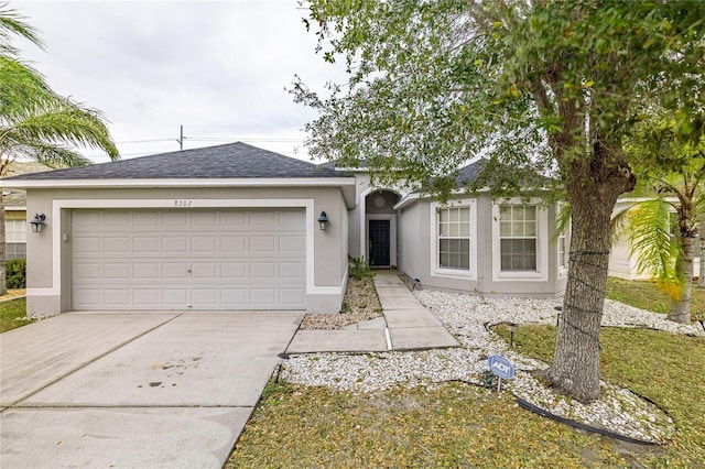 ranch-style home featuring a garage