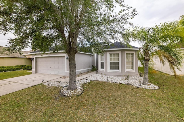 view of front of home with a garage and a front lawn