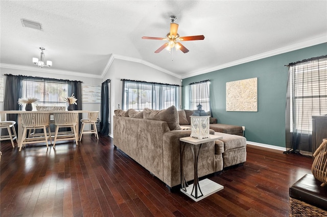 living room with dark hardwood / wood-style flooring, ornamental molding, ceiling fan with notable chandelier, a textured ceiling, and lofted ceiling