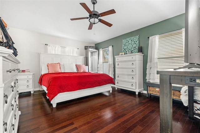 bedroom featuring ceiling fan and dark wood-type flooring