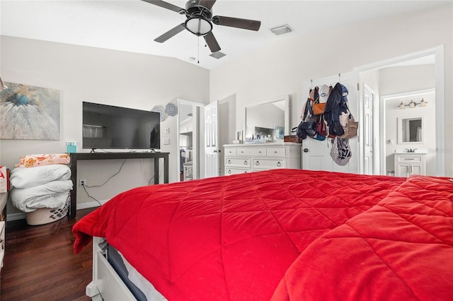 bedroom with ensuite bath, ceiling fan, hardwood / wood-style floors, and vaulted ceiling