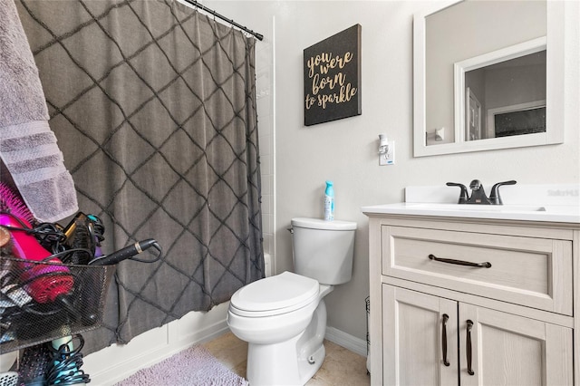 full bathroom featuring tile patterned flooring, vanity, toilet, and shower / tub combo with curtain