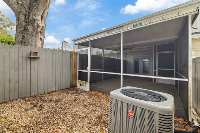 exterior space featuring cooling unit and french doors