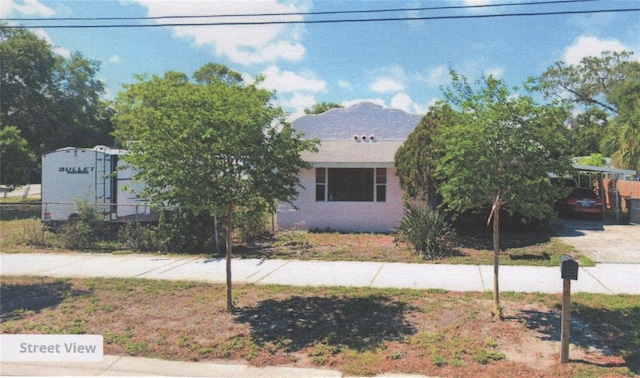 view of front of property with a carport