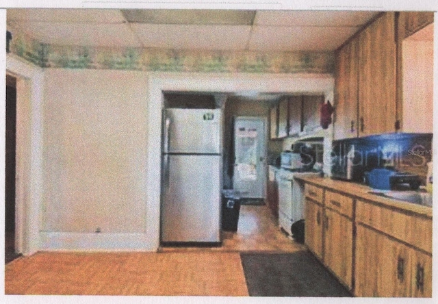 kitchen featuring stainless steel refrigerator